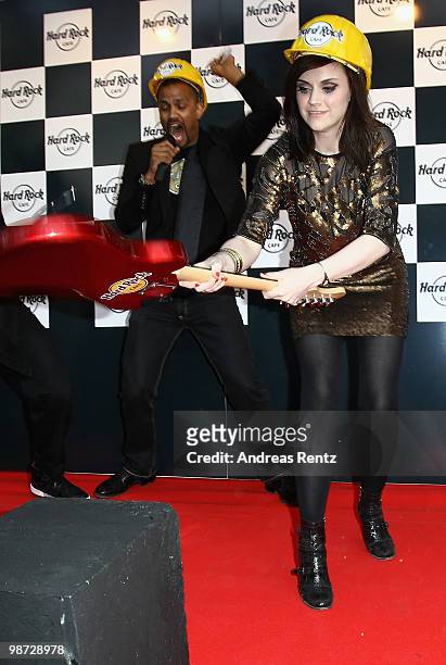 Singer Amy Macdonald smashes a guitar at the Hard Rock Cafe Berlin re-opening on April 28, 2010 in Berlin, Germany.