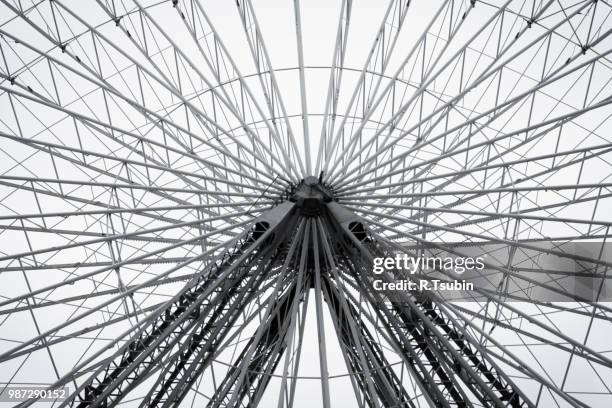 ferris wheel in amusement park. black and white fine art photo - r wheel stock pictures, royalty-free photos & images