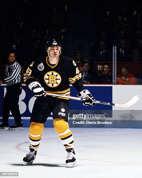 Joe Juneau of the Boston Bruins skates against the Montreal Canadiens in the early 1990's at the Montreal Forum in Montreal, Quebec, Canada.