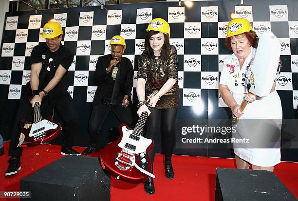 Singer Amy Macdonald smashes a guitar at the Hard Rock Cafe Berlin re-opening on April 28, 2010 in Berlin, Germany.