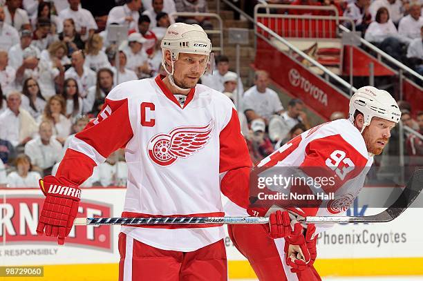 Nicklas Lidstrom and Johan Franzen of the Detroit Red Wings get ready during a face off against the Phoenix Coyotes in Game Seven of the Western...