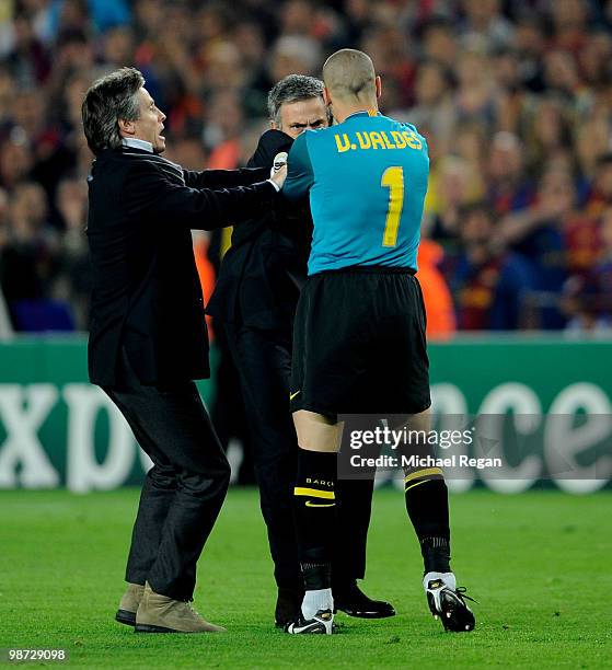 Victor Valdes of Barcelona grapples with Jose Mourinho of Inter Milan after the UEFA Champions League Semi Final Second Leg match between Barcelona...