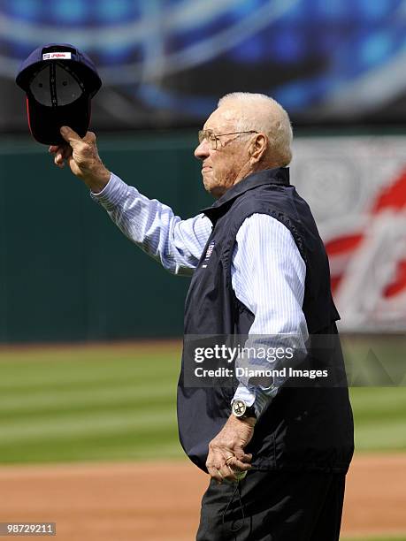 Hall of Fame pitcher Bob Feller of the Cleveland Indians acknowledges the cheers from the crowd before throwing out the ceremonial first pitch prior...