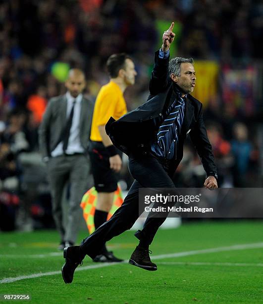 Inter Milan manager Jose Mourinho celebrates victory as barcelona manager Josep Guardiola looks on during the UEFA Champions League Semi Final Second...