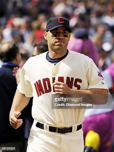 Designated hitter Travis Hafner of the Cleveland Indians runs onto the field during pregame introductions prior to a game on April 12, 2010 against...