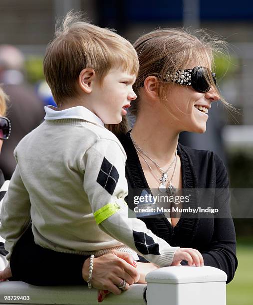 Yulia Arshavin, wife of Arsenal FC player Andrey Arshavin, and son Artyom Arshavin attend the Moss Bros Raceday horse racing meet on April 28, 2010...