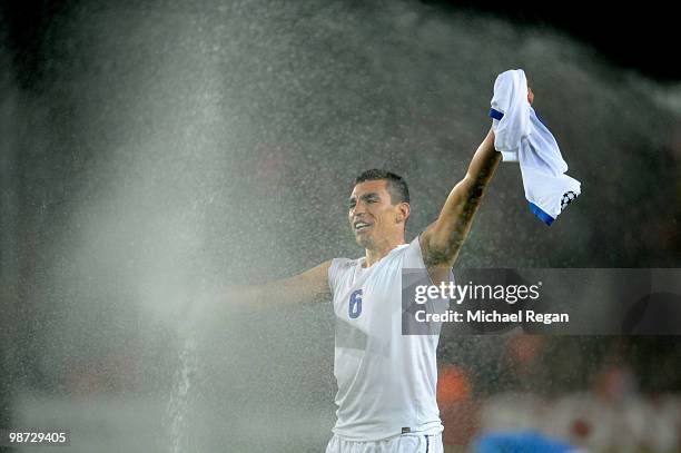 Lucio of Inter Milan celebrates in the sprinklers after victory in the UEFA Champions League Semi Final Second Leg match between Barcelona and Inter...