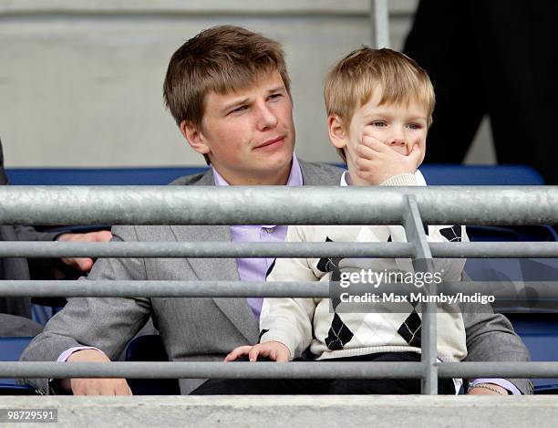 Arsenal FC player Andrey Arshavin and son Artyom Arshavin watch the racing during the Moss Bros Raceday horse racing meet on April 28, 2010 in Ascot,...