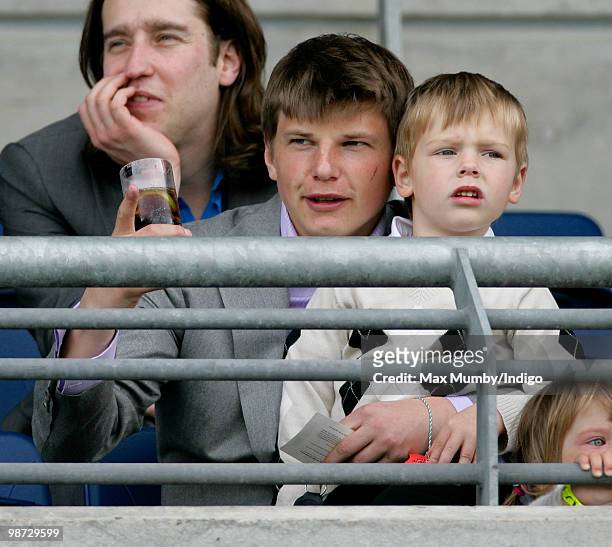 Arsenal FC player Andrey Arshavin and son Artyom Arshavin watch the racing during the Moss Bros Raceday horse racing meet on April 28, 2010 in Ascot,...