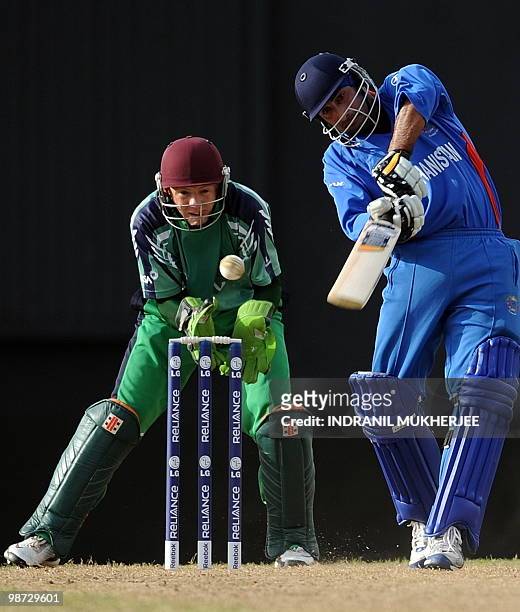 Niall O'Brien of Ireland looks on as Asghar Stanikzai of Afghanistan plays a shotduring the warm-up match between Afghanistan and Ireland at the...
