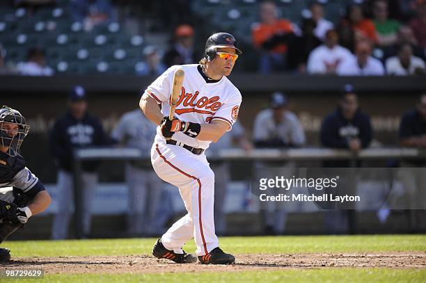 Luke Scott of the Baltimore Orioles takes a swing during a baseball game against the Tampa Bay Rays on April 14, 2010 at Camden Yards in Baltimore,...