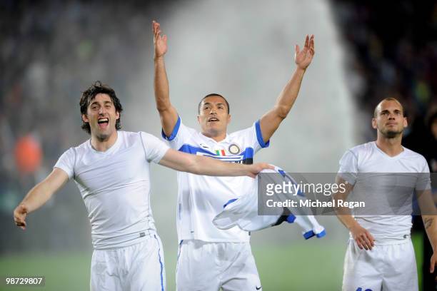Diego Milito of Inter Milan celebrates on the final whistle with team mates Ivan Cordoba and Wesley Sneijder during the UEFA Champions League Semi...