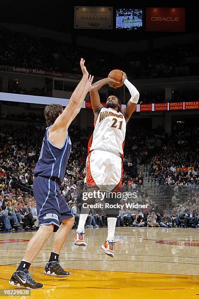 Ronny Turiaf of the Golden State Warriors shoots Mehmet Okur of the Utah Jazz at Oracle Arena on April 13, 2010 in Oakland, California. The Jazz won...