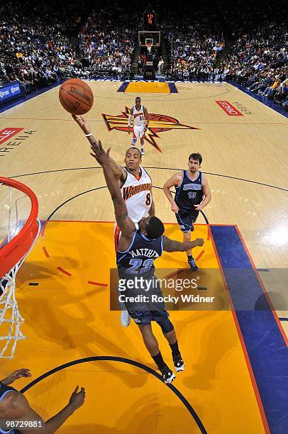 Monta Ellis of the Golden State Warriors lays the ball up over Wesley Matthews of the Utah Jazz at Oracle Arena on April 13, 2010 in Oakland,...
