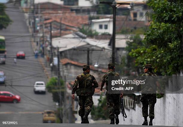 Salvadorean soldiers patrol the surroundings of the penitentiary after three hand granedes exploded inside the jail, in the town of Cojutepeque, 40...