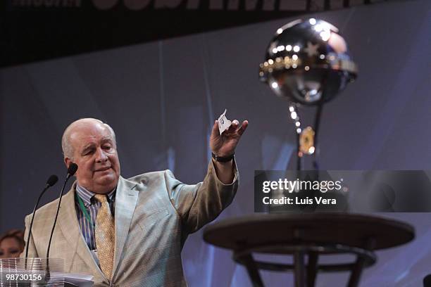 Conmebol's General Secretary General Eduardo de Luca shows a stripe with a team name during the draw of the 2010 Nissan Sudamericana Cup at Conmebol...