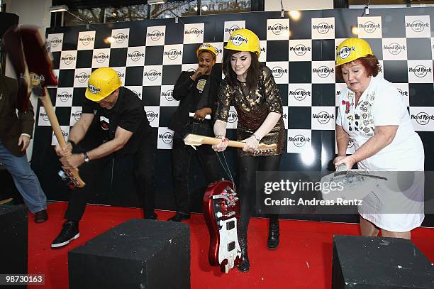 Singer Amy Macdonald smashes a guitar at the Hard Rock Cafe Berlin re-opening on April 28, 2010 in Berlin, Germany.