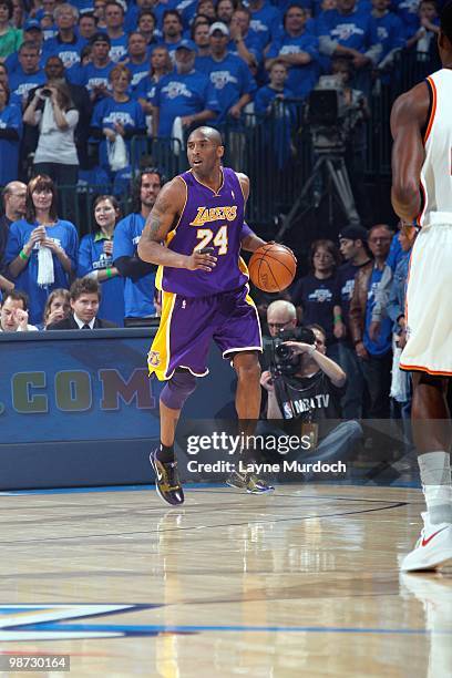 Kobe Bryant of the Los Angeles Lakers dribbles the ball downcourt against the Oklahoma City Thunder in Game Three of the Western Conference...