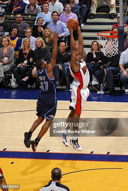 Reggie Williams of the Golden State Warriors goes to the hoop past Ronnie Price of the Utah Jazz at Oracle Arena on April 13, 2010 in Oakland,...