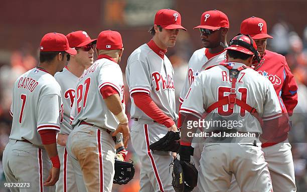 Cole Hamels of the Philadelphia Phillies looks on with teammates after giving up three runs in the sixth inning against the San Francisco Giants...