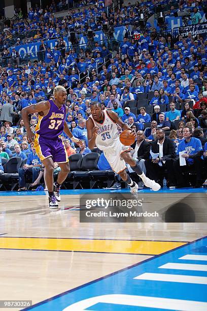 Kevin Durant of the Oklahoma City Thunder drives the ball against Ron Artest of the Los Angeles Lakers in Game Three of the Western Conference...