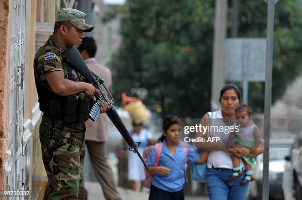 Salvadorean soldiers patrol the surroundings of the penitentiary after three hand granedes exploded inside the jail, in the town of Cojutepeque, 40...