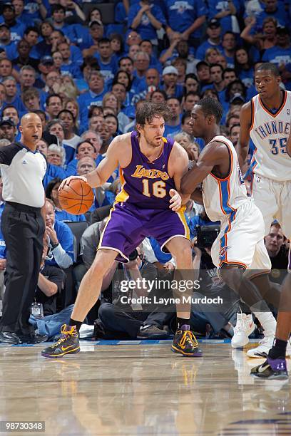 Pau Gasol of the Los Angeles Lakers drives the ball against the Oklahoma City Thunder in Game Three of the Western Conference Quarterfinals during...