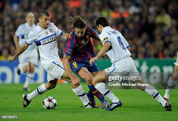 Walter Samuel and Javier Zanetti of Inter Milan challenge Zlatan Ibrahimovic of Barcelona during the UEFA Champions League Semi Final Second Leg...