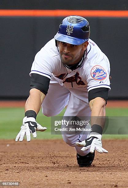 Angel Pagan of the New York Mets dives into third base for a second inning 2 run triple against the Los Angeles Dodgers on April 28, 2010 at Citi...