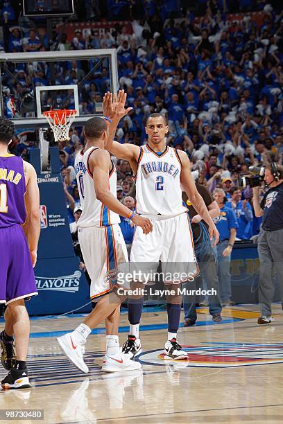 Thabo Sefolosha of the Oklahoma City Thunder and Russell Westbrook celebrate on court against Los Angeles Lakers in Game Three of the Western...