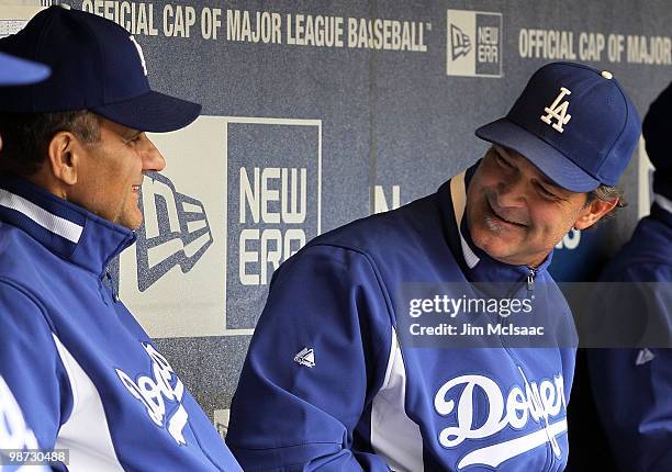 Manager Joe Torre and hitting coach Don Mattingly of the Los Angeles Dodgers have a laugh before their game against the New York Mets on April 28,...