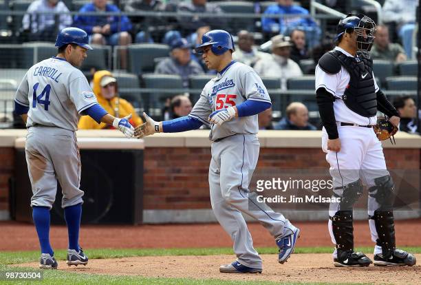Russell Martin of the Los Angeles Dodgers celebrates his two run fifth inning home run with teammate Jamey Carroll as Rod Barajas of the New York...