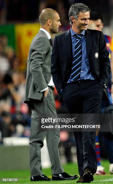 Inter Milan's Portuguese coach Jose Mourinho smiles next to Barcelona's coach Josep Guardiola during the UEFA Champions League semi-final second leg...