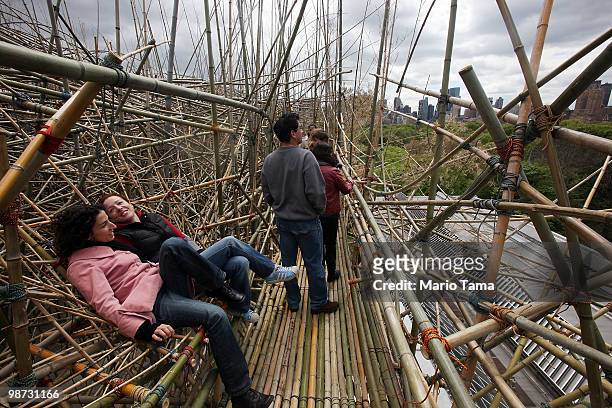 Visitors, including Emily Wolman and Gina Seghi, tour the Big Bambu structure created by twin brothers Mike and Doug Starn on the Metropolitan Museum...