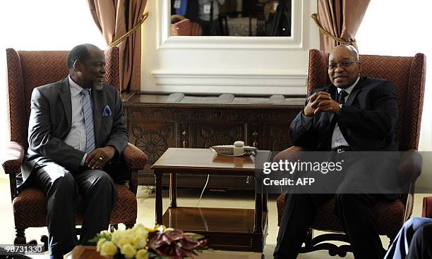 South African president Jacob Zuma talks to the head of the mediation of the Southern African Development Community Joachim Chissano at the...