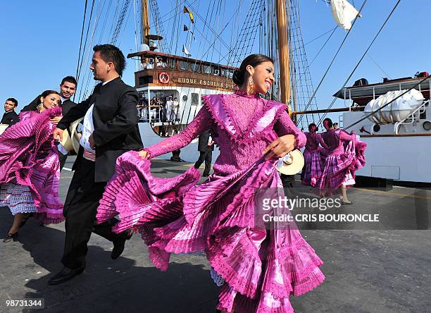 Peruvian dancers perform for the Ecuadorean cadets aboard their sailboat Guayas, after they moored at the Callao Naval Base in Peru, on April 28,...