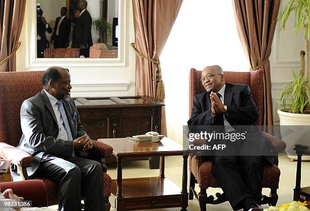 South African president Jacob Zuma talks to the head of the mediation of the Southern African Development Community Joachim Chissano at the...