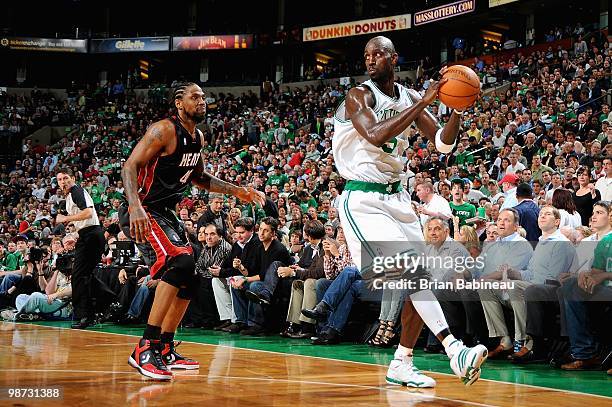 Kevin Garnett of the Boston Celtics looks to pass over Udonis Haslem of the Miami Heat in Game Five of the Eastern Conference Quarterfinals during...