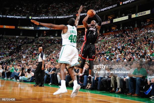 Dwyane Wade of the Miami Heat shoots over Michael Finley of the Boston Celtics in Game Five of the Eastern Conference Quarterfinals during the 2010...