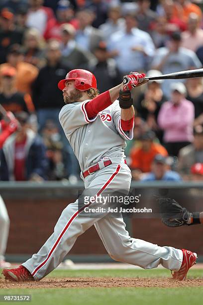 Jayson Werth of the Philadelphia Phillies hits a three run double in the ninth inning against the San Francisco Giants during an MLB game at AT&T...