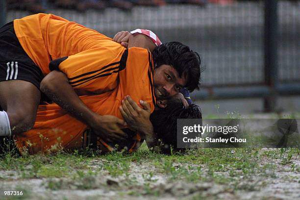 Mohd Syamsuri hugs Kamarulzaman Hassan of Malaysia Under-23 Goalkeeper after the final whistle to celebrate Malaysia qualifies for the semi-finals in...