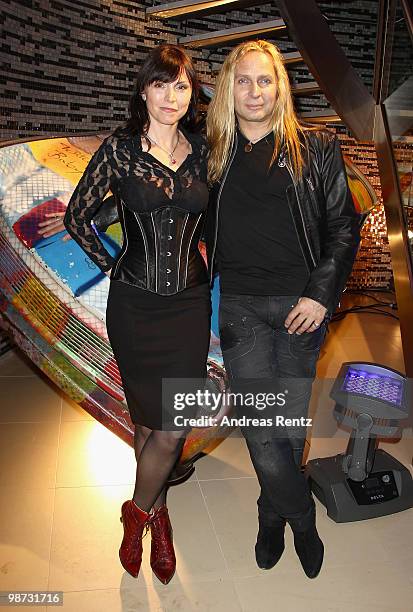 Uwe Hassbecker, guitarist of the band Silly, with partner Utah attend the Hard Rock Cafe Berlin re-opening on April 28, 2010 in Berlin, Germany.