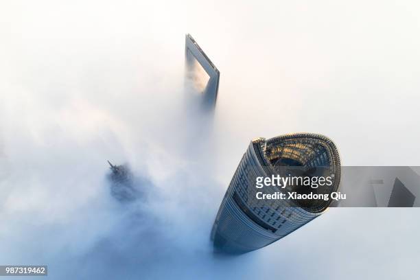 aerial view of shanghai lujiazui  in clouds - skyscraper stock pictures, royalty-free photos & images