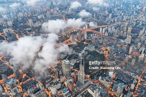 aerial view of shanghai puxi in clouds - puxi foto e immagini stock