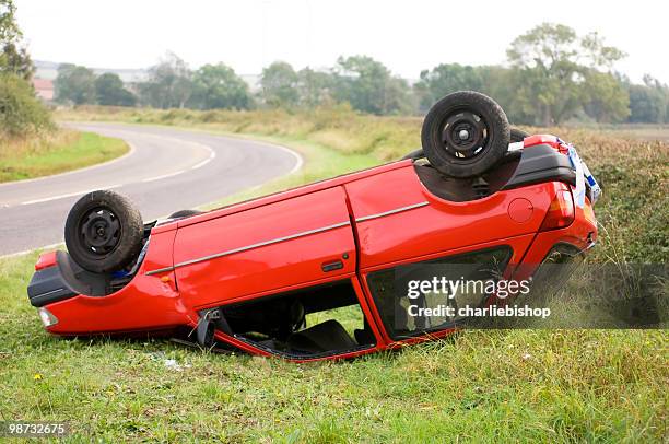 upturned car on the side of the road - road speed bumps stock pictures, royalty-free photos & images