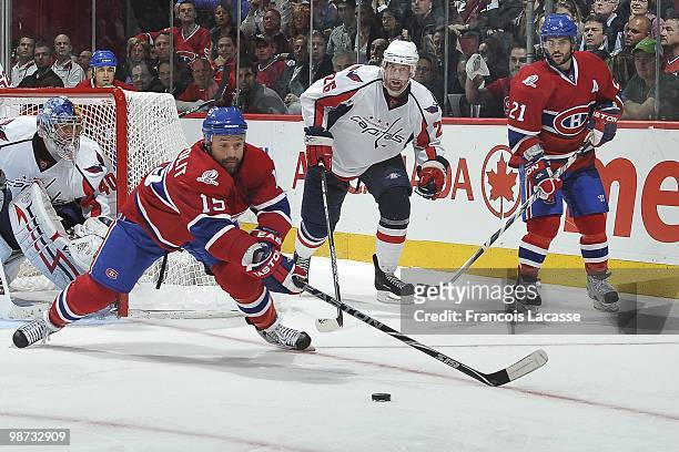 Glen Metropolit of Montreal Canadiens reaches for the puck in Game Six of the Eastern Conference Quarterfinals during the 2010 NHL Stanley Cup...