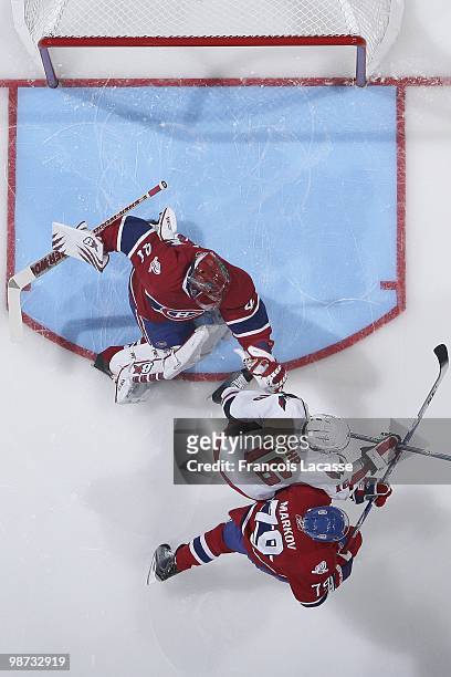 Jaroslav Halak of Montreal Canadiens tries to keep the front of his net clear in Game Six of the Eastern Conference Quarterfinals during the 2010 NHL...