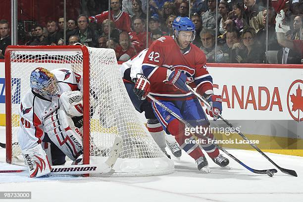 Dominic Moore of the Montreal Canadiens skates around Semyon Varlamov's net in Game Six of the Eastern Conference Quarterfinals during the 2010 NHL...