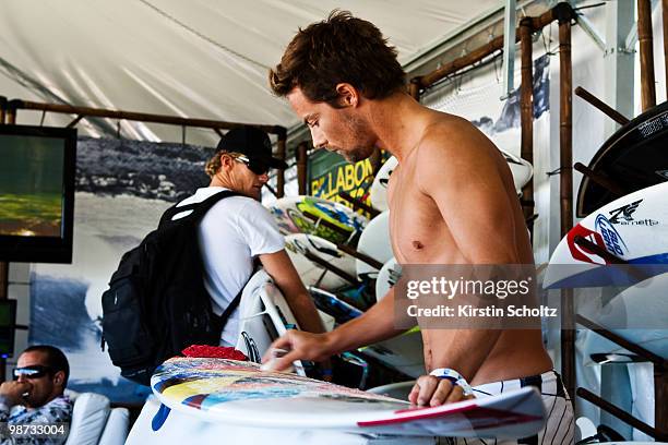 Travis Logie of South Africa waxes his board during the 2010 Santa Catarina Pro on April 28, 2010 in Santa Catarina, Brazil.