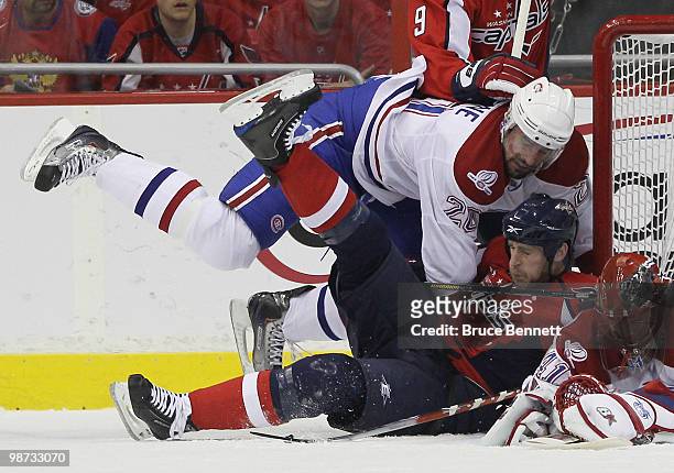 Ryan O'Byrne of the Montreal Canadiens takes down Brooks Laich of the Washington Capitals in Game Seven of the Eastern Conference Quarterfinals...